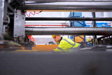 Blue collar worker and cardboard package factory.