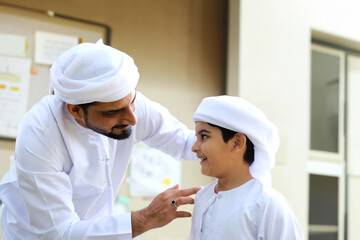 Arab parent with child. Middle East father together with son ideal for family mock up.
