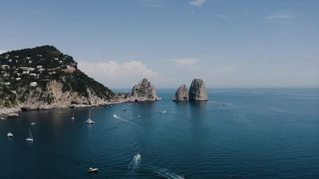 Aerial view of the Tyrrhenian Sea surrounding Italy's coast on a bright summer day.