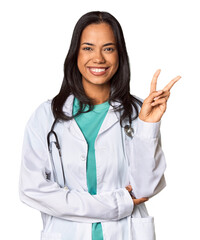 Young Filipina doctor with stethoscope in studio showing number two with fingers.