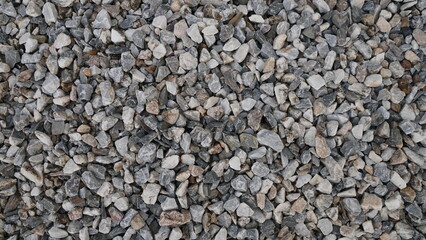 Gravel texture. Small stones on the ground. Small stones background.