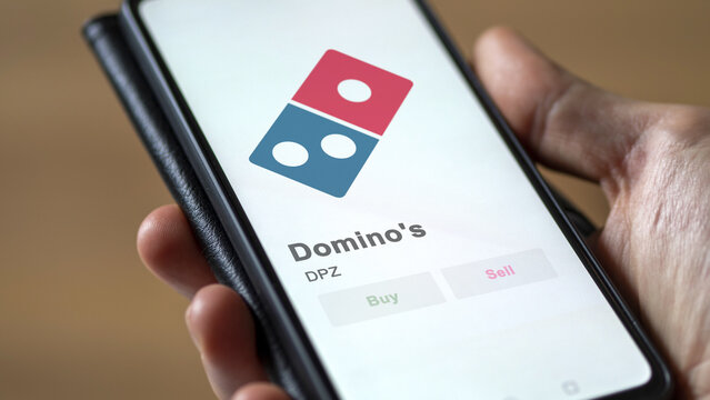 October 28th 2023. The Domino's shares on the screen of a stocks exchange. Domino's price stocks, $DPZ on a device.