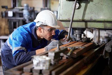 Fototapeta na wymiar factory worker or technician checking and control lathe machine in factory