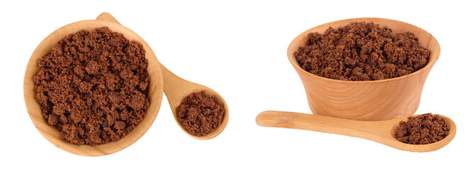 Dark muscovado sugar or Barbados sugar in wooden bowl isolated on white background. Top view. Flat...