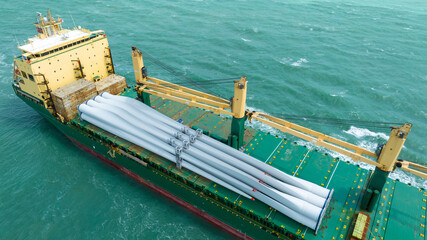 Wind Turbine on Ship, Transportation of blades for wind turbines on a cargo ship. Heavy load...