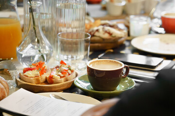 Breakfast table in a restaurant. - obrazy, fototapety, plakaty