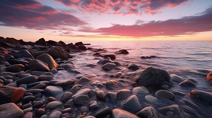 Obraz premium Ethereal Sunset Over Pebbled Shoreline