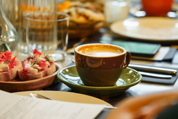 Cup of coffee. Breakfast table in a restaurant.