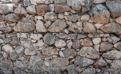 Ancient wall background with old concrete bricks