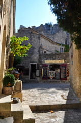 Les Baux de Provence, France - Streets of the old town with stone houses shops and restaurants in the south of France in the Provence region.