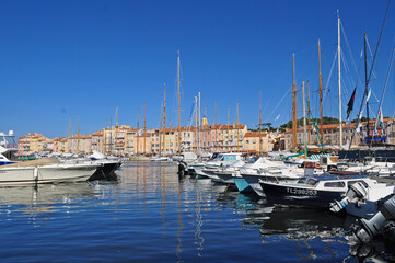 Fototapeta na wymiar Boats parked at sea in the harbor in Saint Tropez, France.