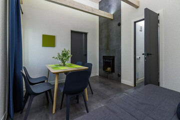 Stylish modern interior with table and chairs in the pre-bath area