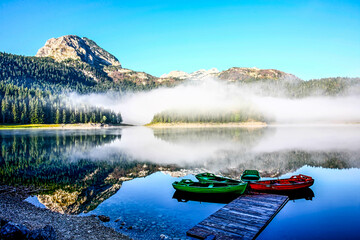 Morning on a mountain lake. View at Black Lake on Durmitor Mountain in Montenegro. HDR Image (High Dynamic Range).