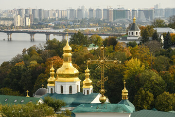 Panoramic view of Kyiv Pechersk Lavra churches, the Dnieper river and high buildings in Kyiv, Ukraine. October 23, 2023
