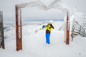 Slovakia, Jasna - January 31, 2022: woman skier on the top of the chopok mountain