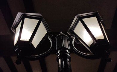 Old street lights in the dark background, vintage lamps
