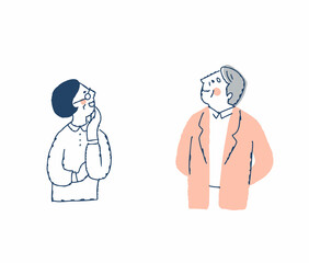 上の方を見ながら喜ぶシニアカップル