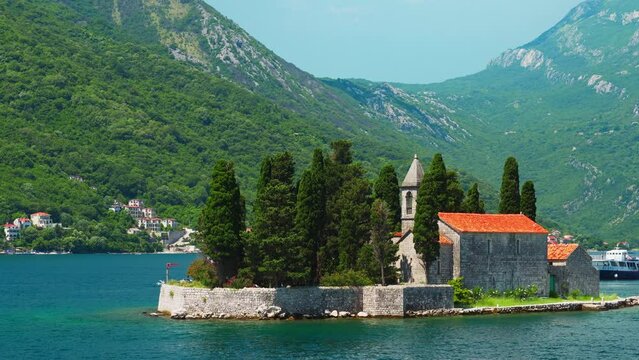 St.George Catholic monastery, Bay of Kotor, Montenegro, seascapes, a view of a small island with an old building and a church in the bay against the background of mountains and beautiful nature