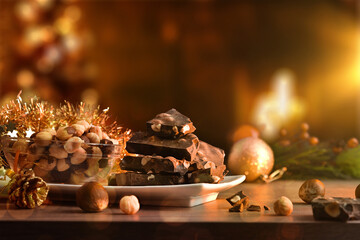 Chocolate with hazelnuts in Christmas atmosphere illuminated at night