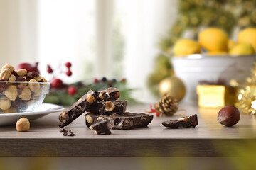 Chocolate candies with window and Christmas tree in living room