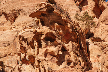 Narrow road to Ad Deir monastery in Petra Jordan. Mountain landscapes with steep abysses. Road between rocks going up. Rocky rocks of red, pink and orange tones.