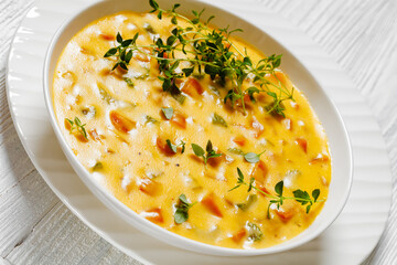 Beer cheese soup with vegetables and thyme