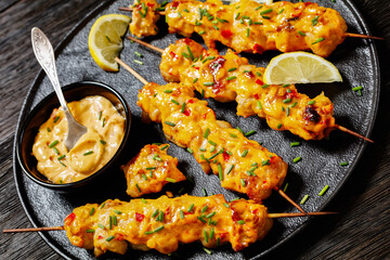 Bang Bang Chicken Skewers on plate, top view
