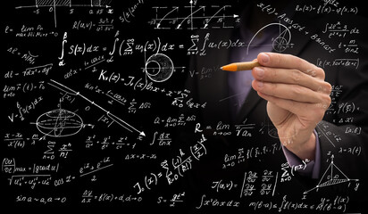 Male hand writing mathematical formulas on blurry background. Science and algebra concept. Double...