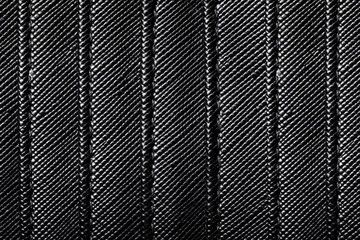 Fake leather texture. Closeup fabric. Black leather imitation stripes. Textile lines pattern. Shiny...