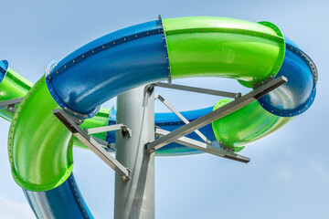 Blue and green water slide on a summer day