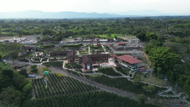 Aerial of Parque del Cafe in Quindio Colombia with green fields of coffee plants