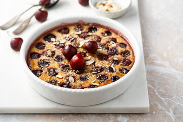 Homemade cherry clafoutis with almond flakes