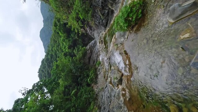 Aerial vertical flight over Rio Bani River in Wilderness near waterfall Las YAYITAS on Dominican Republic 
