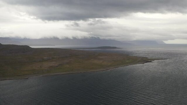 Aerial view of coastline at Westfjords during dark grey cloudy day on Iceland Island