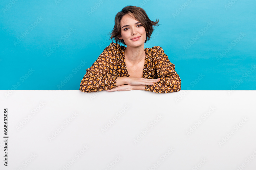 Sticker photo of stunning positive lady showing empty space ad sale offer blank isolated on blue color backg