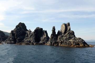 Fototapeta na wymiar The stones of the Finger Cape on Askold Island in Peter the Great Bay. Primorsky Krai
