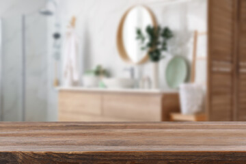 Empty wooden table in bathroom. Space for design