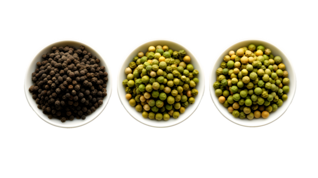 Trifecta of pepper spices Trio green white and black peppercorns in bowls Overhead shot With copyspace for text