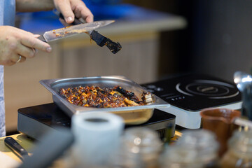 Chef plating a dish in the kitchen