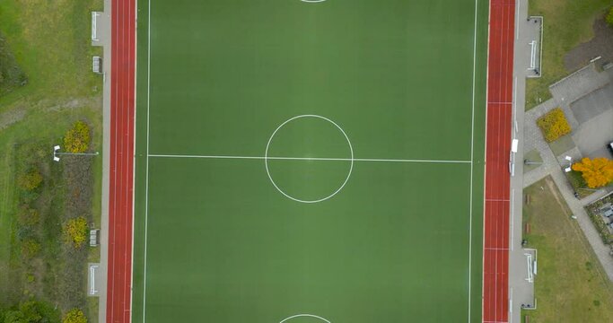 4k 60fps drone footage of an empty soccer field spinning