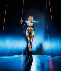 Fashion model posing Fantasy cyborg woman creative robot costume metal body creative makeup...