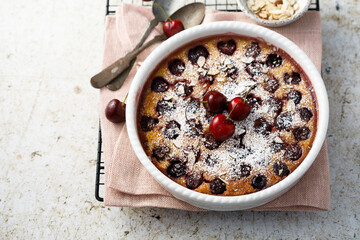 Homemade cherry clafoutis with almond flakes