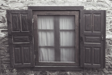 Wooden window of an old house in Şirice