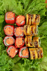 sushi rolls photo on lettuce leaves