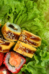 sushi rolls photo on lettuce leaves