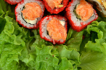 sushi rolls photo on lettuce leaves
