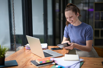 Businesswoman planning project with marketing calculations for plans and results