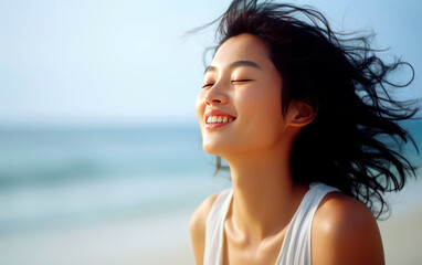 Young asian woman breathing fresh air in the beach. - obrazy, fototapety, plakaty