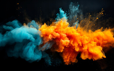 Blue and orange colored powder explosions over black background. Holi paint powder splash.