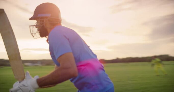 Cinematic Close Up Portrait of a Player Executing a Perfect Cricket Batting Stroke. Batsman Running Across the Pitch to Secure a Run. Opponent Team Trying to Recover the Ball